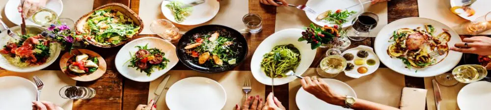 birds view of a table in a restaurant with different dishes