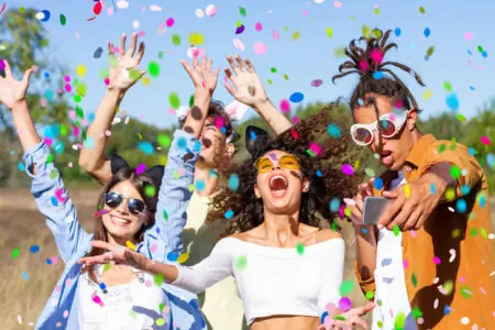 People dancing with confetti