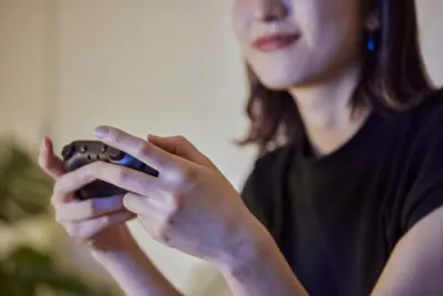 Woman gaming with controller