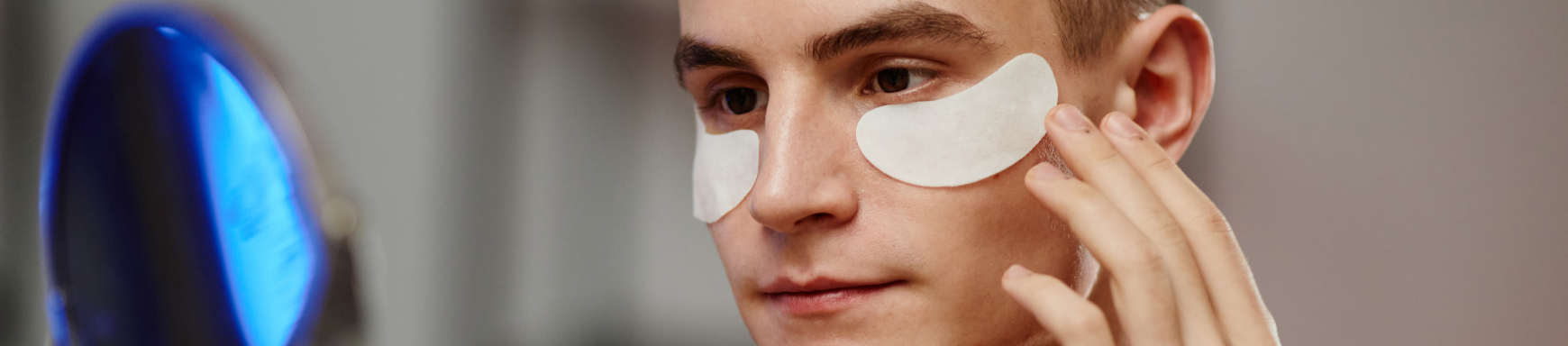 Male consumer engaging with skincare products.