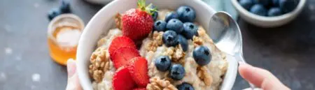 Healthy Eating: Bowl of porridge with blueberries and strawberries