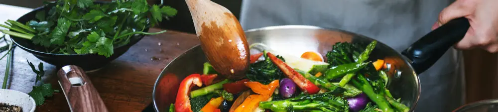 Vegetables being fried in a pan