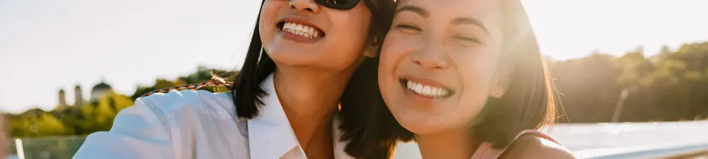Two girls smiling taking a selfie