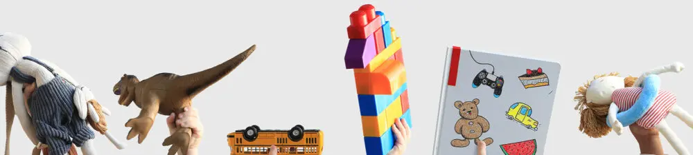 Children holding up different toys