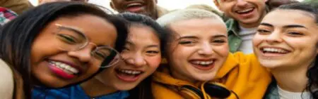 Group of Gen Z, smiling into the camera