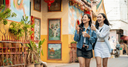 Two girls walking down the street in south East Asia