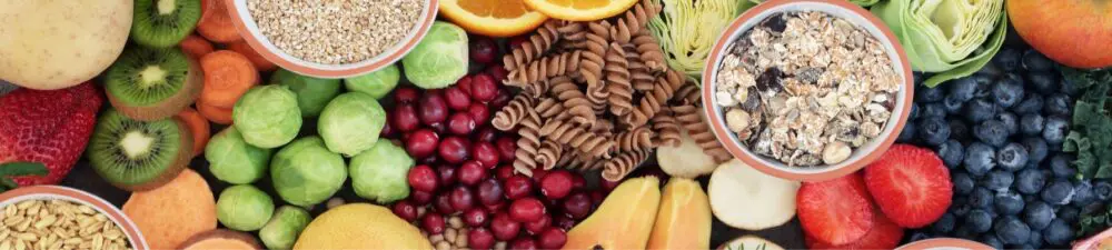 Collection of colourful high fibre fruits and vegetables on a table.