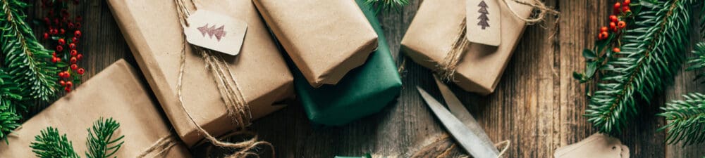 Presents wrapped in brown paper and eco-friendly leaves