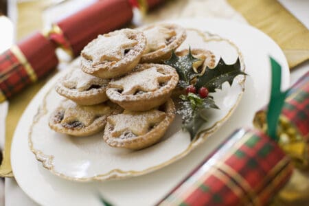 Mince Pies on a plate with two Christmas crackers