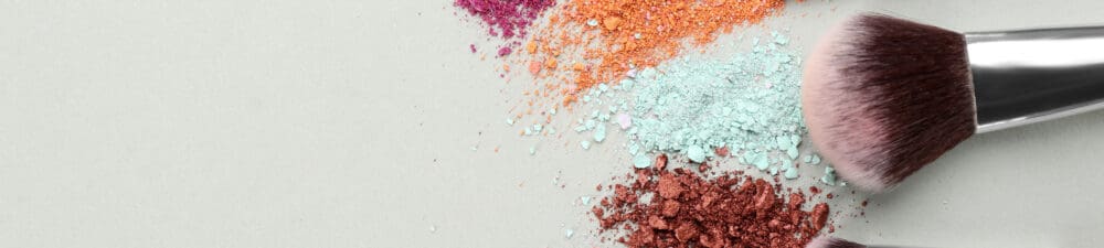 Colourful make up powder and brushes