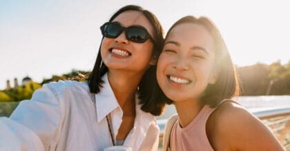 Two girls smiling taking a selfie