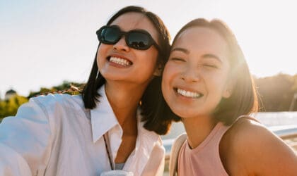 Two girls smiling taking a selfie