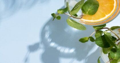 Two glasses of a lemon inspired alcoholic drinks.
