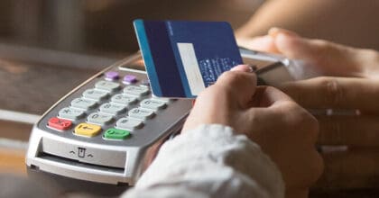 Someone tapping their bank card on a card machine