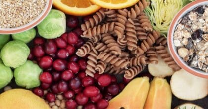 Collection of colourful high fibre fruits and vegetables on a table.