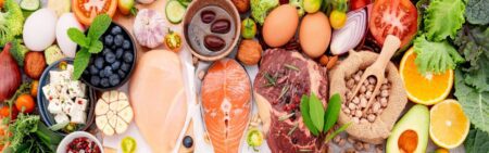 A spread of foods, including vegetables, fruit, meats, and fish.